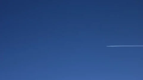 Plane leaves a trail in the sky Stock Footage 40433729