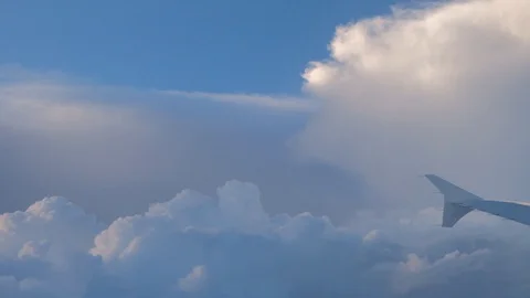 Plane lifting upwards. View of the wing through the plane window. Stock Footage 130150294