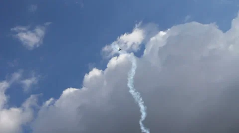Plane looping between the clouds Stock Footage 30988806