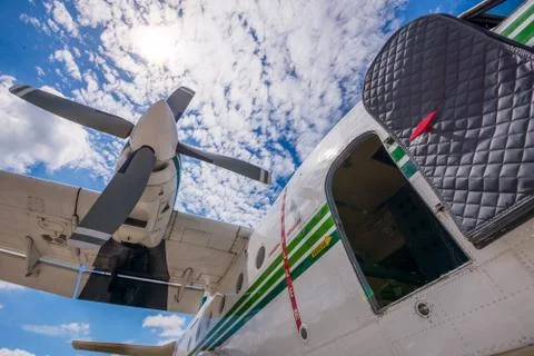 The plane made artificial rain Stock Photos