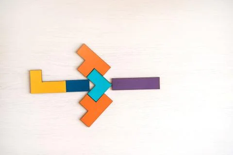 Plane made from tangram puzzle on table. Stock Photos
