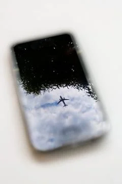 Plane on mobile telephone Stock Photos