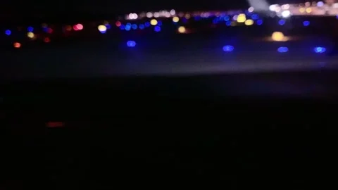 Plane motion with luminous, lights, runway searchlights, view from window a.. Video stock 226220608