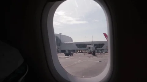 The plane moves along the runway view from the window of the plane. Stock-Footage 115546777