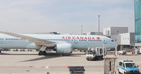The plane moves to take off by Air Canada plane stands at Frankfurt Airport Stock Footage 112616168