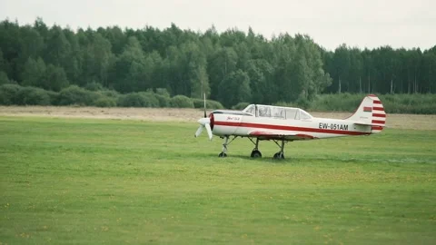 The plane is moving across the field Stock Footage 147716382