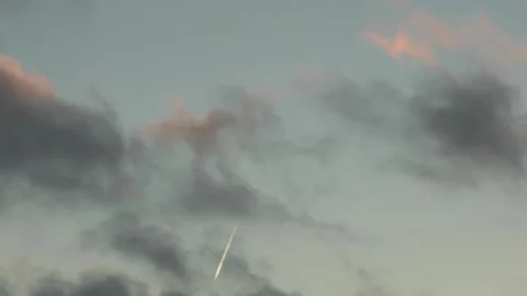 Plane Moving Through Evening Clouds Time-Lapse 스톡 동영상 143563220