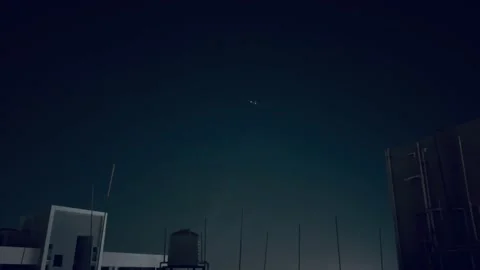 Plane in the night sky Stock Footage 234052091