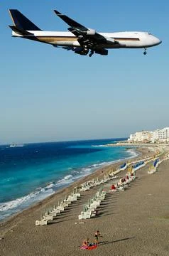 Plane over beach Stock Photos