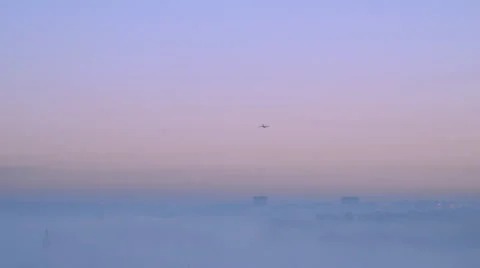 Plane over misty dawn Stock Footage 51445687