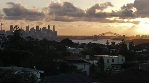 Plane over Sydney cityscape at sunset 4K Stock Footage 195963458