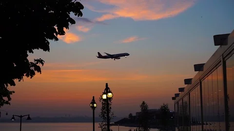 Plane pass on sunset Stock Footage 93614366