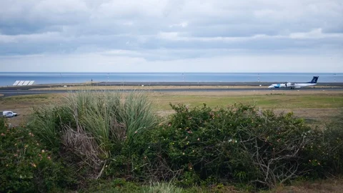 Plane passes by the camera on the side against the sea Stock Footage 102073331