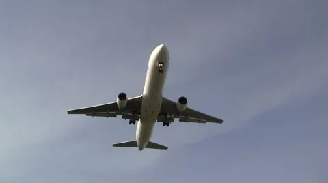 Plane passes overhead at Schiphol Stock Footage