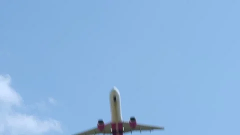 Plane passing above in the blue sky Stock Footage 253708039