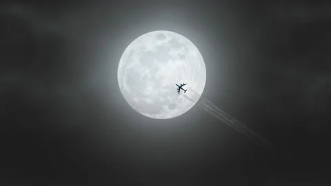 Plane passing over full moon light night loop Video stock 212643154