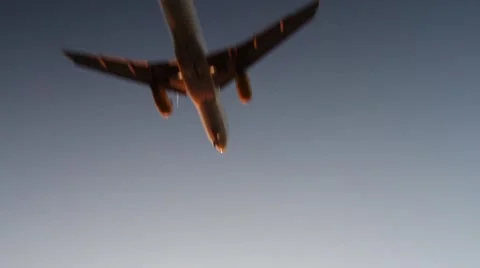 Plane passing by while higher plane flies above in the sky Video stock 45977860