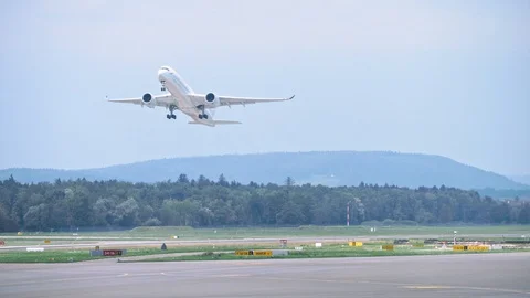 Plane picks up speed while moving along the runway, airplane takes off. 4K Stock Footage 121280321