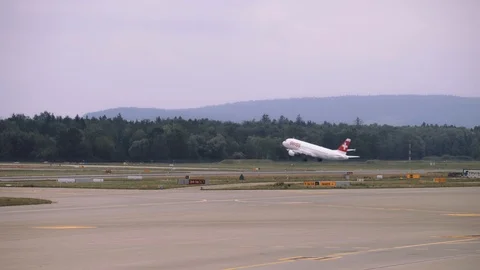 Plane picks up speed while moving along the runway, airplane takes off. 4K Stock Footage 121571415