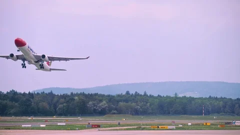 Plane picks up speed while moving along the runway, airplane takes off. 4K Stock Footage 121571622