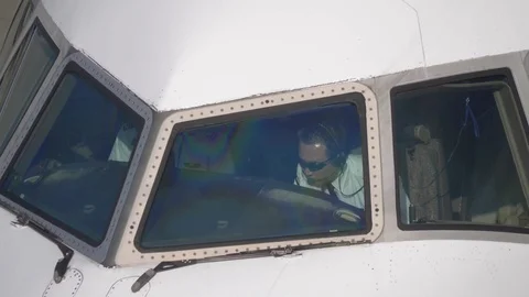 Plane Pilots in the Cockpit of Their Commercial Airplane Stock Footage 120036465