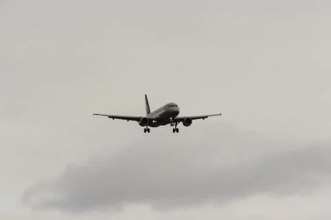 The plane is preparing to land. Stock Photos