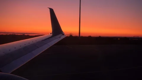The plane is preparing for take-off. The wing of the plane is shaking. In the Stock Footage 115365195