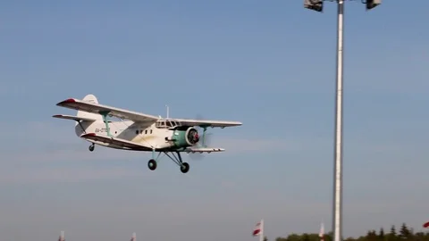 A plane with a propeller at high speed flies at a low altitude Stock Footage 107653273