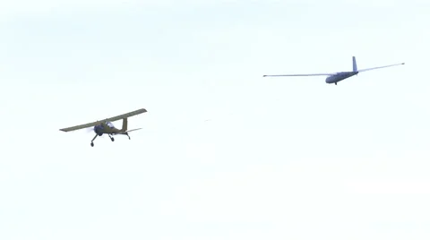 Plane pulls  glider on  cable in air Stockbeeldmateriaal 56134679