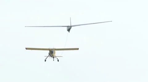 Plane pulls  glider on  cable in air, rear view  Vídeo Stock 56134739