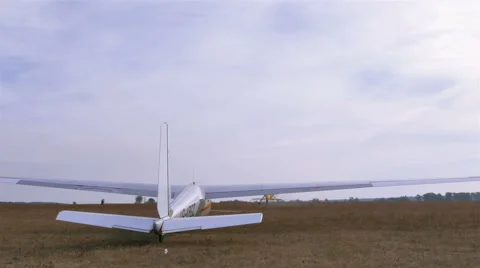 Plane pulls  glider on  cable in air. Rear view.  Stockbeeldmateriaal 56205495