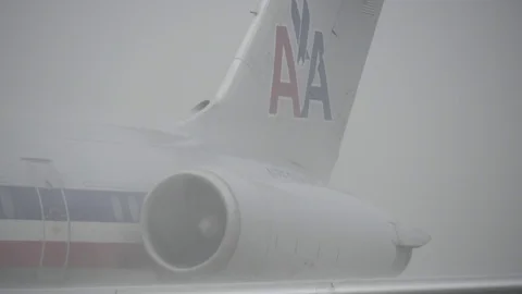 Plane on Rainy  Tarmac Stock Footage 70818096