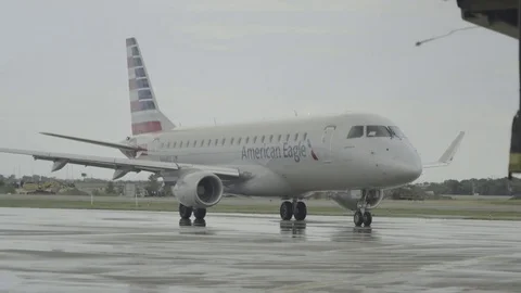 Plane on rainy tarmac Stock Footage 70818971