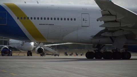 Plane ready for take off rolls on runway at airport. 4K Stock Footage 117182557