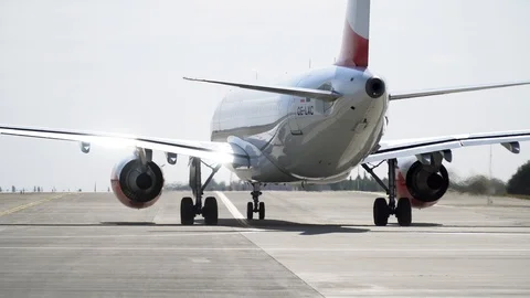 Plane ready for take off rolls on runway at airport. 4K Stock Footage 117182815