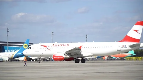 Plane ready for take off rolls on runway at airport. 4K Stock Footage 117182818