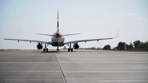 Plane ready for take off rolls on runway at airport. 4K Video stock 117184245