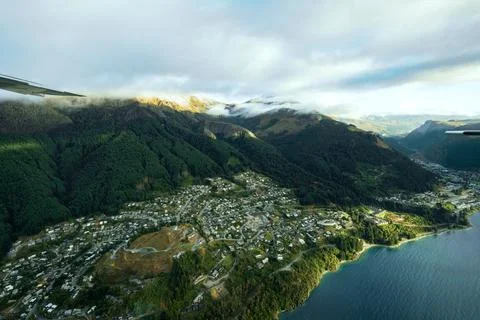 Plane ride at sunrise over mountain range of Milford sound showing mountain.. Stock-Fotos
