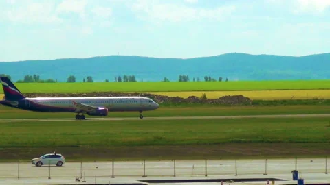 Plane on the runway is preparing for takeoff Stock Footage 121734642