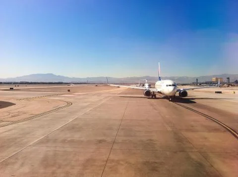 Plane on runway ready to take off. Stock Photos