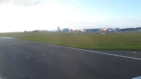Plane runway window view UK Stock Footage 230457876