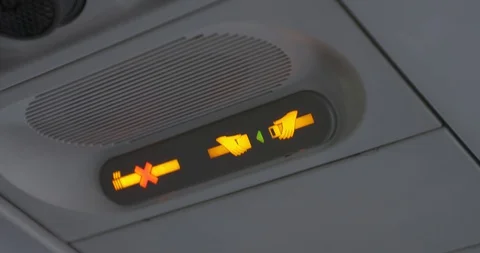 Plane seatbelt sign, bumpy, shaky ride with turbulance Stock Footage 127928341
