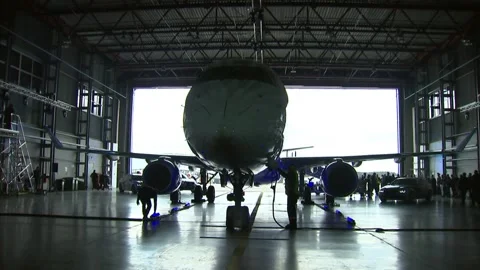The plane is served in the hangar Stock Footage 88738934