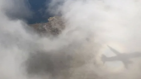 Plane shadow on clouds over Malta Stock Footage 124999836