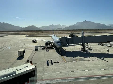 A plane sits at the gate in San Jose del Cabo, Mexico Stock Photos