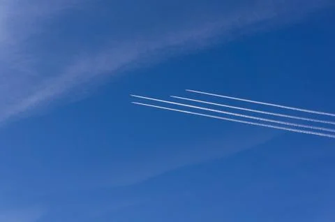 Plane in the sky. 4 aircraft in the same direction. Stock Photos
