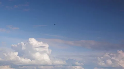 PLANE IN SKY WITH CLOUDS Stock Footage