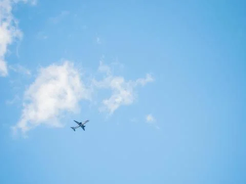 Plane in the Sky clouds Foto stock