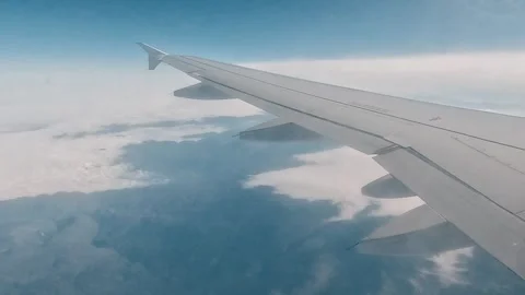 Plane Sky Window Wings Clouds Earth Background Stock Footage 339969452
