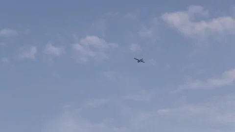 Plane small aircraft airplane flying transport vehicle wings sky clouds blue Stock Footage 332913916